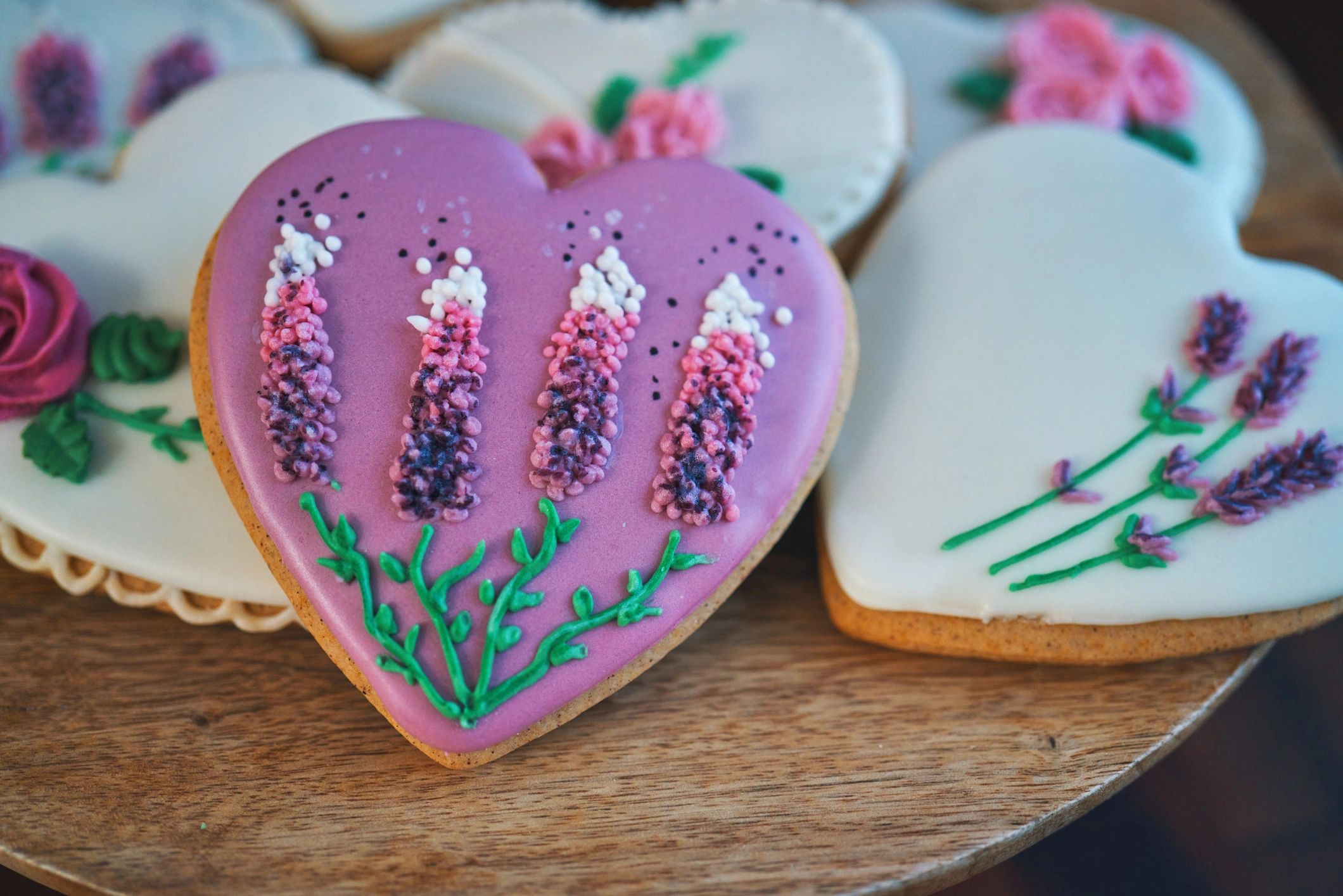 Decorated heart-shaped cookies in bright icing