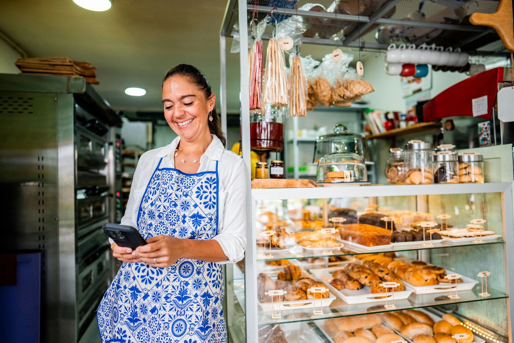 Smiling customer in a bakery setting